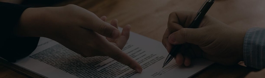 businessman signing document
